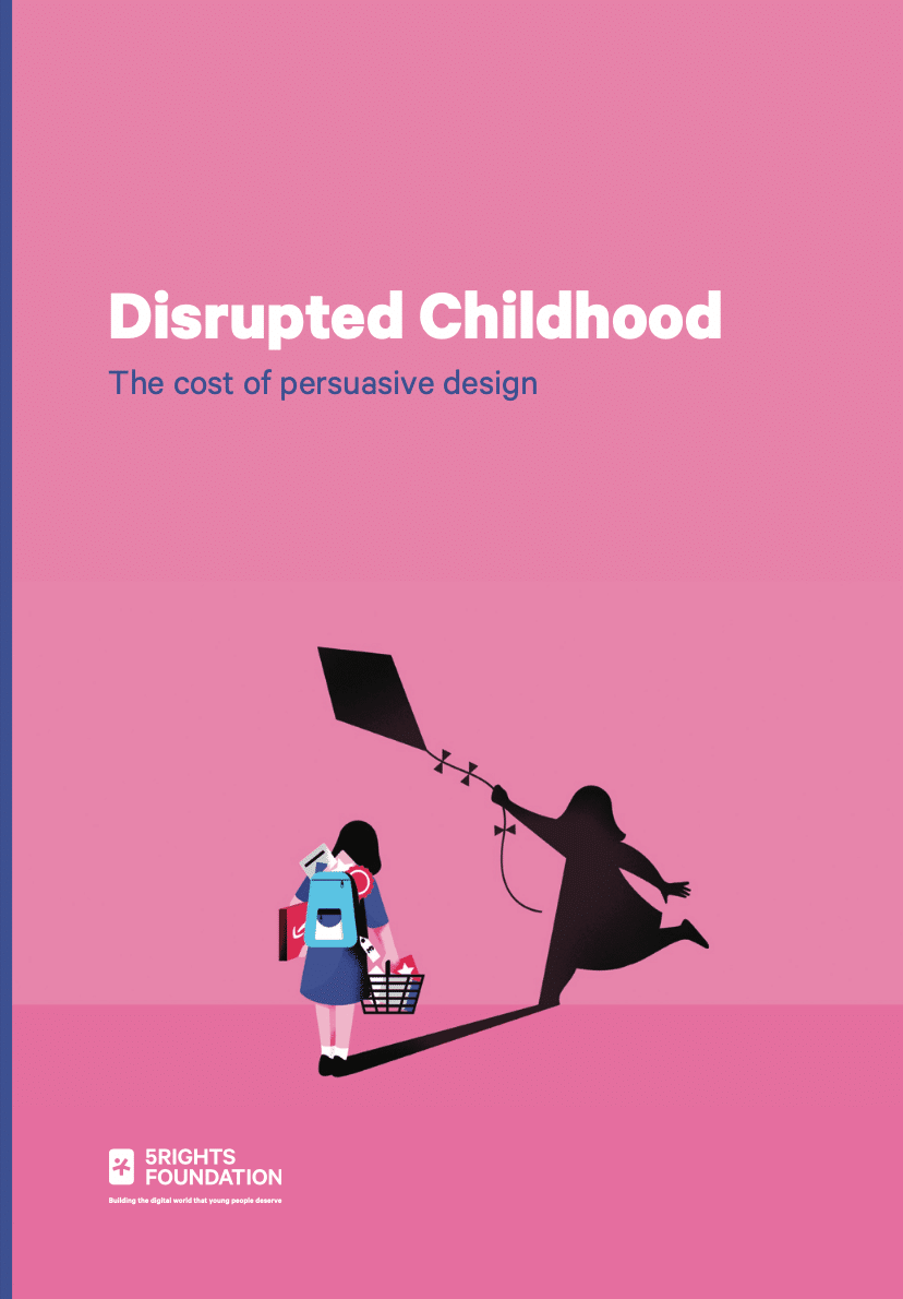 This image is the cover of a report titled "Disrupted Childhood: The cost of persuasive design" by the 5Rights Foundation. The background is primarily pink with dark blue accents. The central illustration depicts a young girl dressed in a school uniform, holding a shopping basket, with her back turned towards the viewer. The girl's shadow on the ground shows a silhouette of her holding a kite, symbolising a carefree, playful childhood. The contrasting image of the girl carrying shopping bags while her shadow plays with a kite highlights the theme of how persuasive design in digital products impacts children's lives. The logo of the 5Rights Foundation is displayed in the bottom left corner, accompanied by the tagline, "Building the digital world that young people deserve."