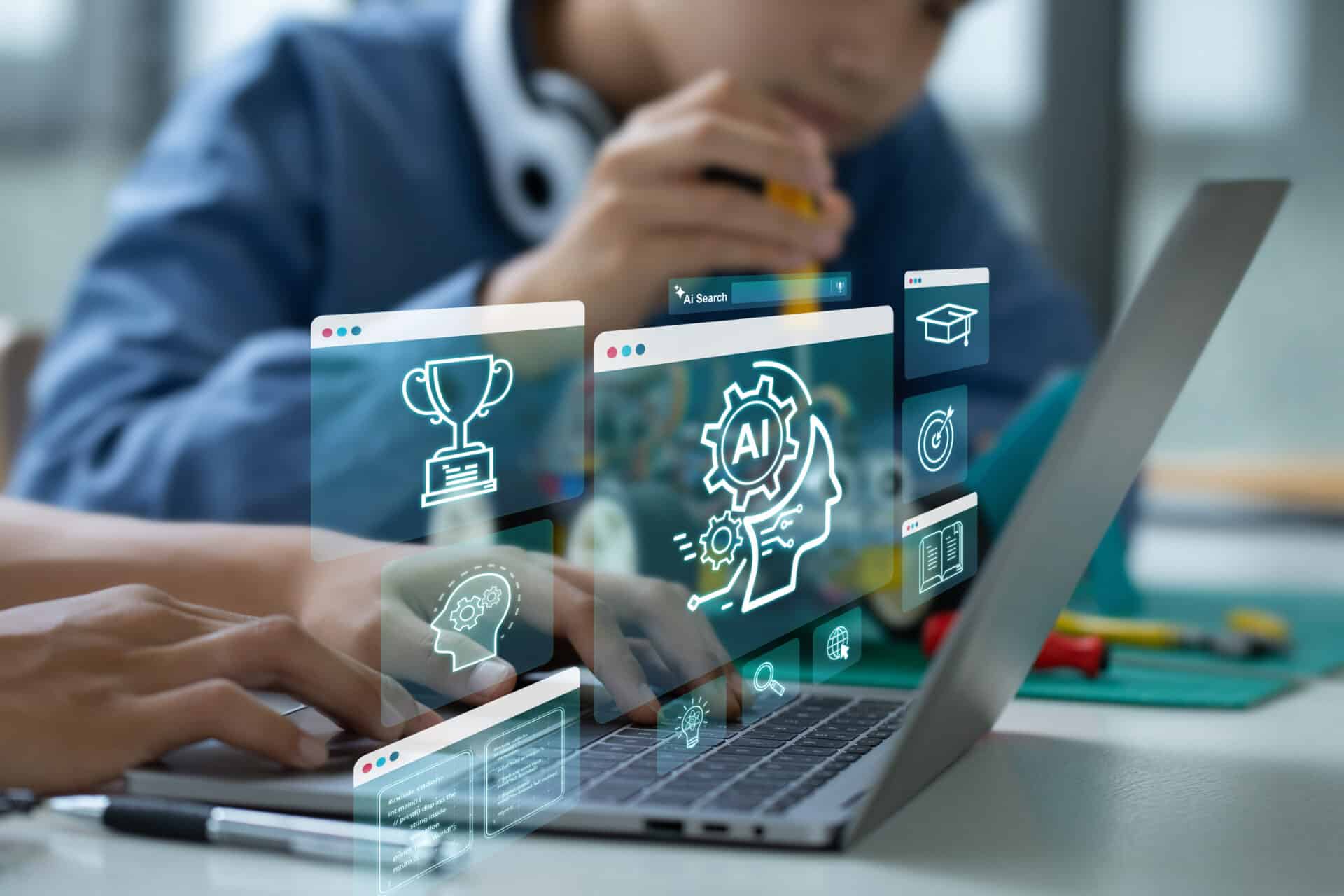 A laptop is being used with symbols highlighted, including an AI icon and a trophy icon. A child is working on something in background